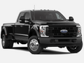 Black Ford Super Duty F-450 dually truck shown as a reference for compatible steering components and heavy-duty upgrade fitment.
