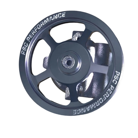 A metallic gray CSC Performance pulley wheel shown at a three-quarter angle against a dark studio background.