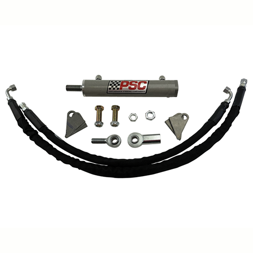Collection of steering parts including a PSC cylinder, rod ends, mounts, hoses and hardware on a white background. 