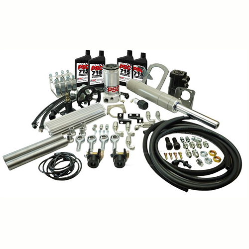Full hydraulic steering kit with a double-ended PSC brand cylinder, four PSC 715 bottles, a PSC reservoir, black orbital, silver cooler, belt, clevis ends, hoses, fittings and hardware on a white background. 