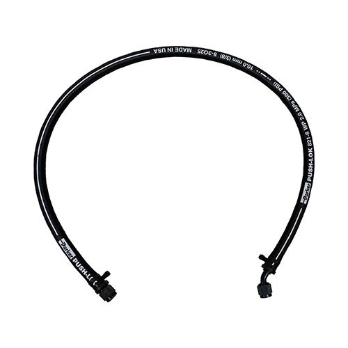 Long black hose with smooth arc shape and push lock style fittings used to route fluid from the cooler to the power steering reservoir.