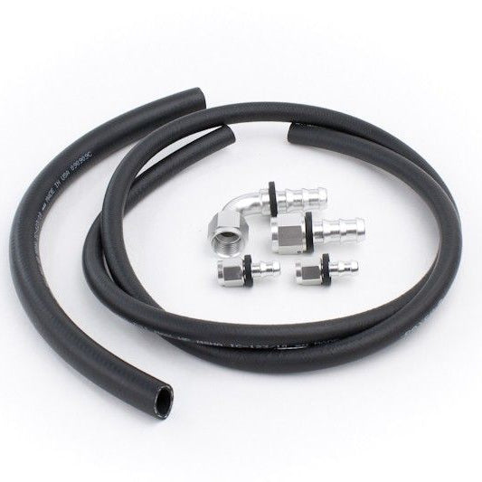 A hose kit with a low pressure rubber return hose, low pressure rubber feed hose and push-lock hose ends in front of a white background. 