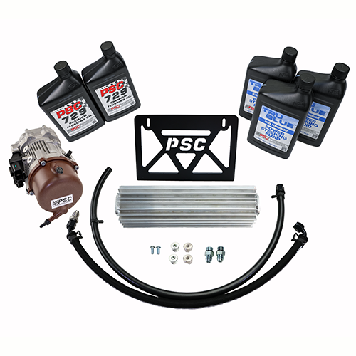 Complete performance steering cooler kit including a pump, mounting bracket, aluminum cooler, hoses, fittings, and PSC-branded fluid bottles (two PSC 729 flushing fluid and three PSC 8061 power steering fluid) arranged on a white background.