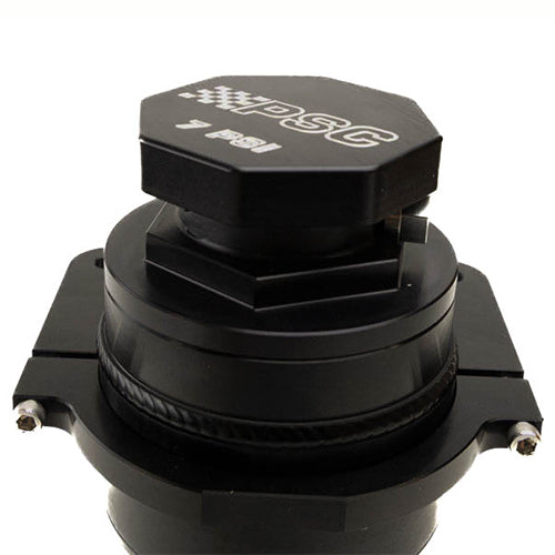 Close up of a black steering reservoir cap component with 'PSC' branding on a white background. 