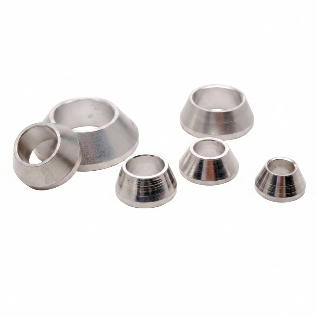 Set of metallic cone-shaped objects on a white background