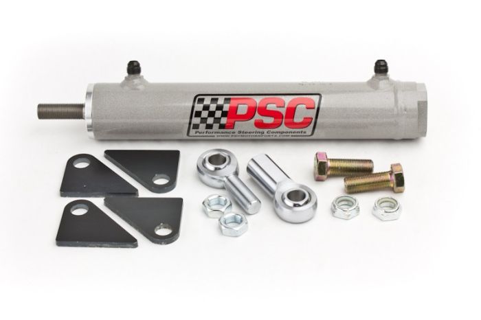 Photo of a single-ended steering assist cylinder with clevis ends, hardware and mounting plates on a white background. 