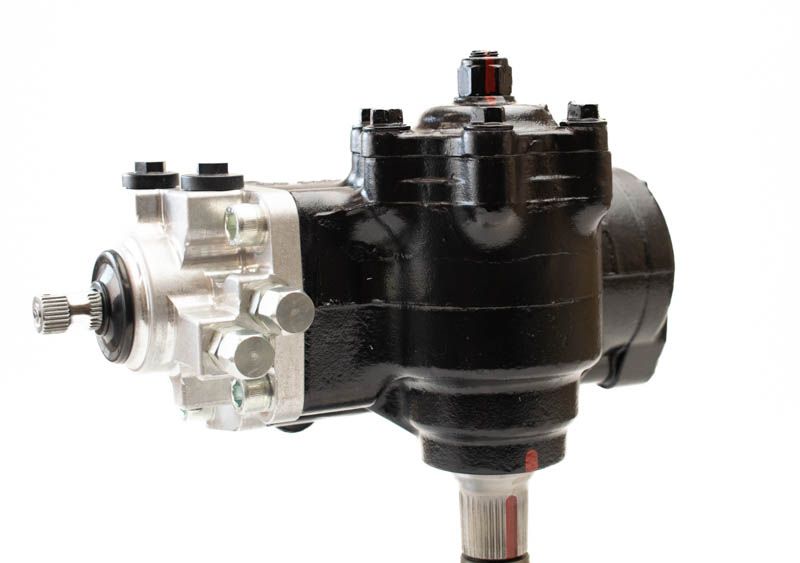 PSC Big Bore XD® steering gear with black and silver anodization for use with 2nd gen Dodge RAM trucks to fir n 1994-2002 RAM 2500/3500 on a white background.