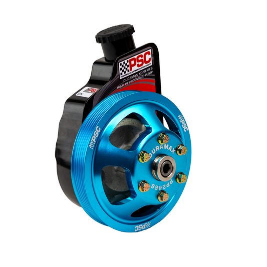Angled PSC high-performance power steering pump assembly featuring a teal anodized PP2466 Duramax pulley with machined spokes, six gold-tone pulley bolts, attached fluid reservoir and black inlet tube, photographed on a white background.