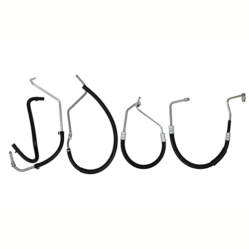 A five-piece power steering hose set displayed against a white background, featuring a mix of rigid metal lines and flexible black hydraulic hoses with precision-crimped fittings. Each hose is shaped differently with bends, curves, and connection angles designed for an exact vehicle-specific routing, showcasing PSC’s durable construction and OE-style metal ends for reliable steering fluid delivery.