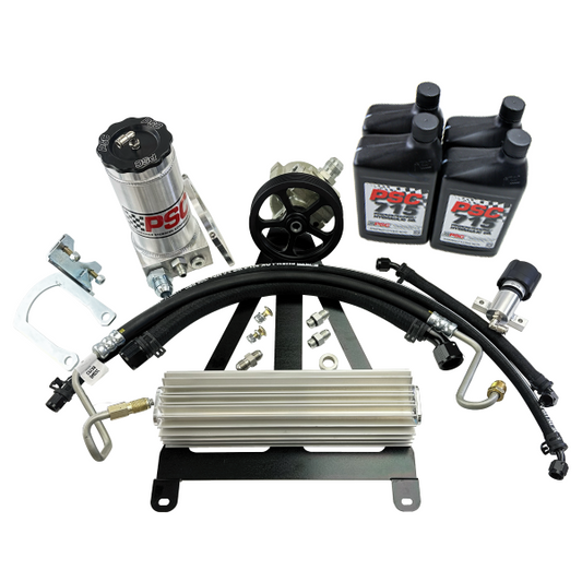 Automotive parts including hoses, connectors, and a cooler on a white background