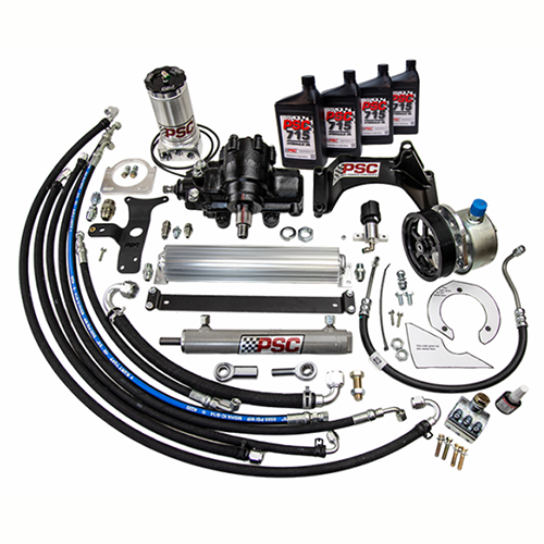 A complete PSC steering kit displayed with a steering gear, hydraulic assist cylinder, remote reservoir, pump, cooler, hoses, fittings, brackets, steering fluid and installation hardware designed for high-demand off-road steering systems.