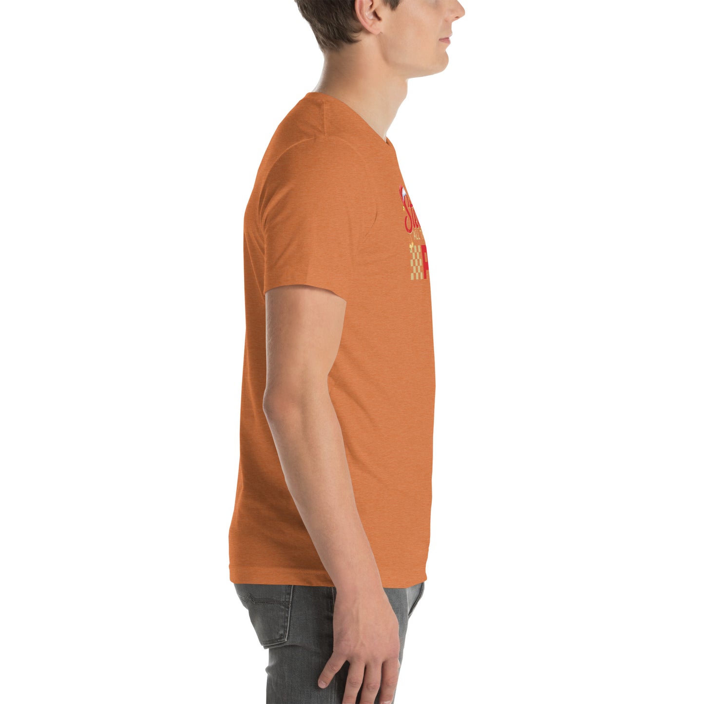 Side view of an adult model facing the right edge of the screen wearing a heather autumn orange short-sleeve T-shirt you can see the edge of a red and gold design on the front of the shirt. The background is white. 