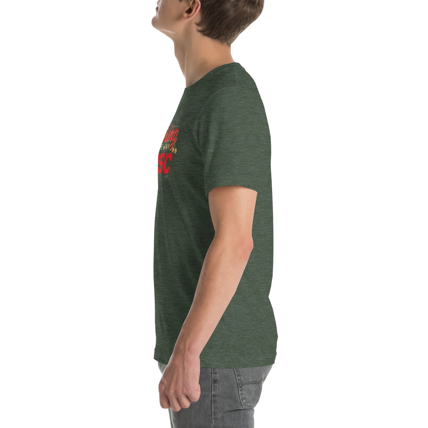 Side view of an adult model facing the left edge of the screen wearing a heather forest green short-sleeve T-shirt you can see the edge of a red and gold design on the front of the shirt. The background is white.