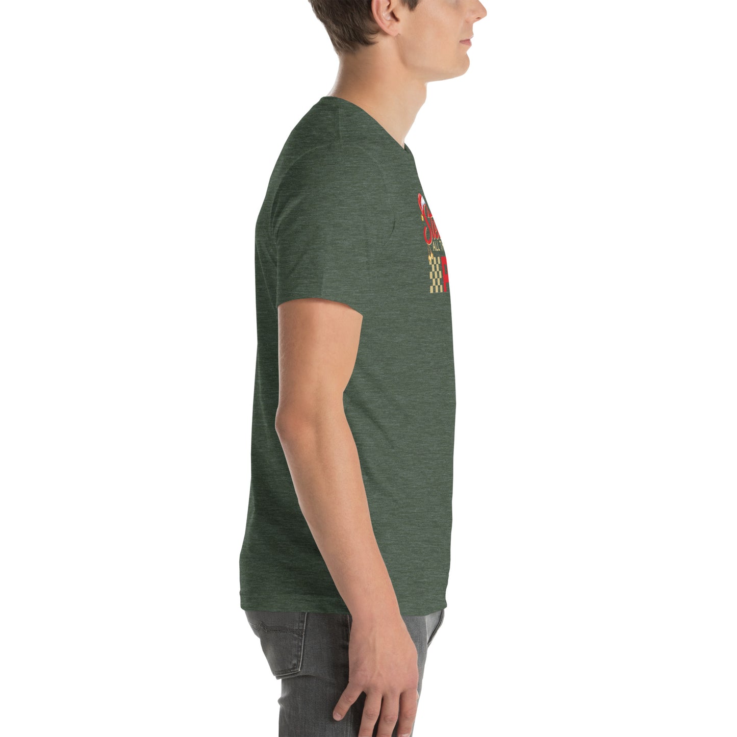 Side view of an adult model facing the right edge of the screen wearing a heather forest green short-sleeve T-shirt you can see the edge of a red and gold design on the front of the shirt. The background is white.