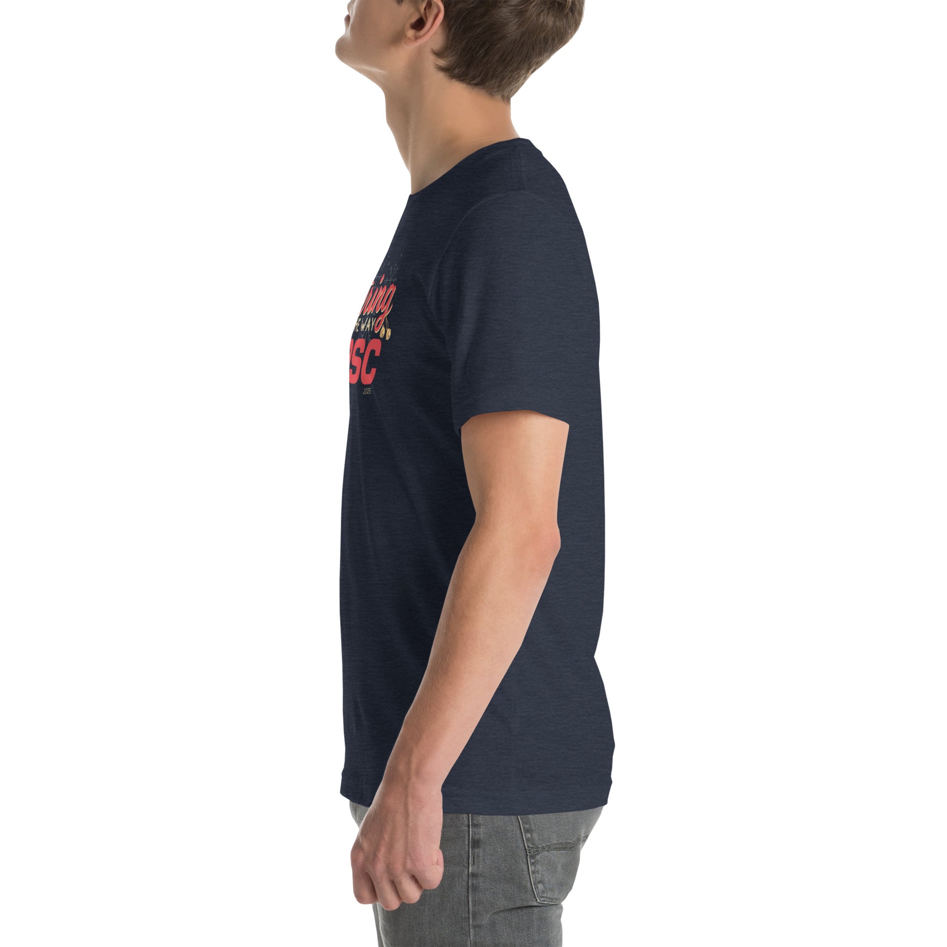 Side view of an adult model facing the left edge of the screen wearing a heather navy blue short-sleeve T-shirt you can see the edge of a red and gold design on the front of the shirt. The background is white.