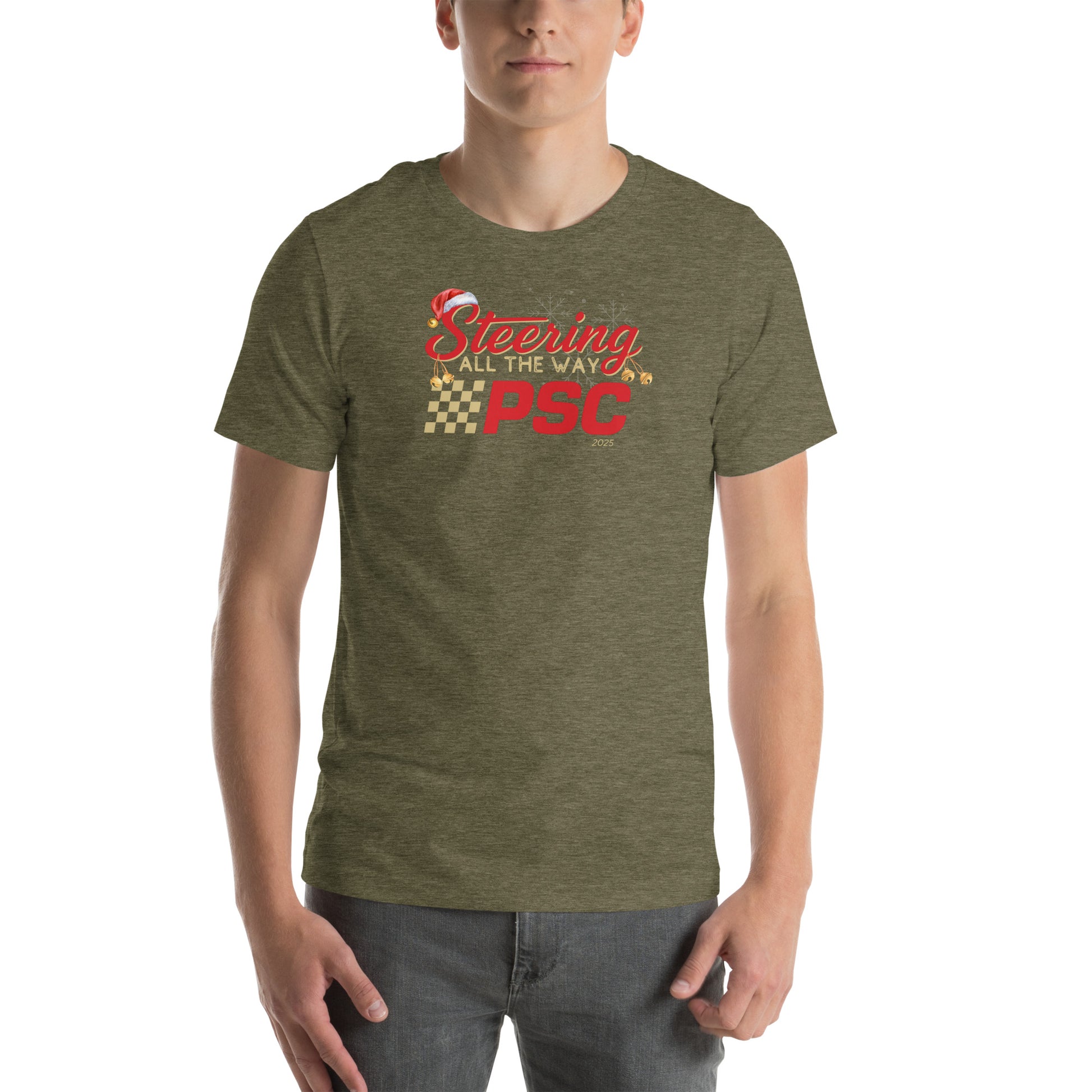 Front view of an adult model wearing a heather olive green short-sleeve T-shirt with a PSC logo and the phrase ‘Steering All the Way PSC 2025’ printed across the chest in red and gold lettering. There is a Santa hat on the "S" in steering, bells handing off the bottom of the "S" and "g" in steering and translucent snowflakes in the background as well as "2025" right bottom corner offset. 