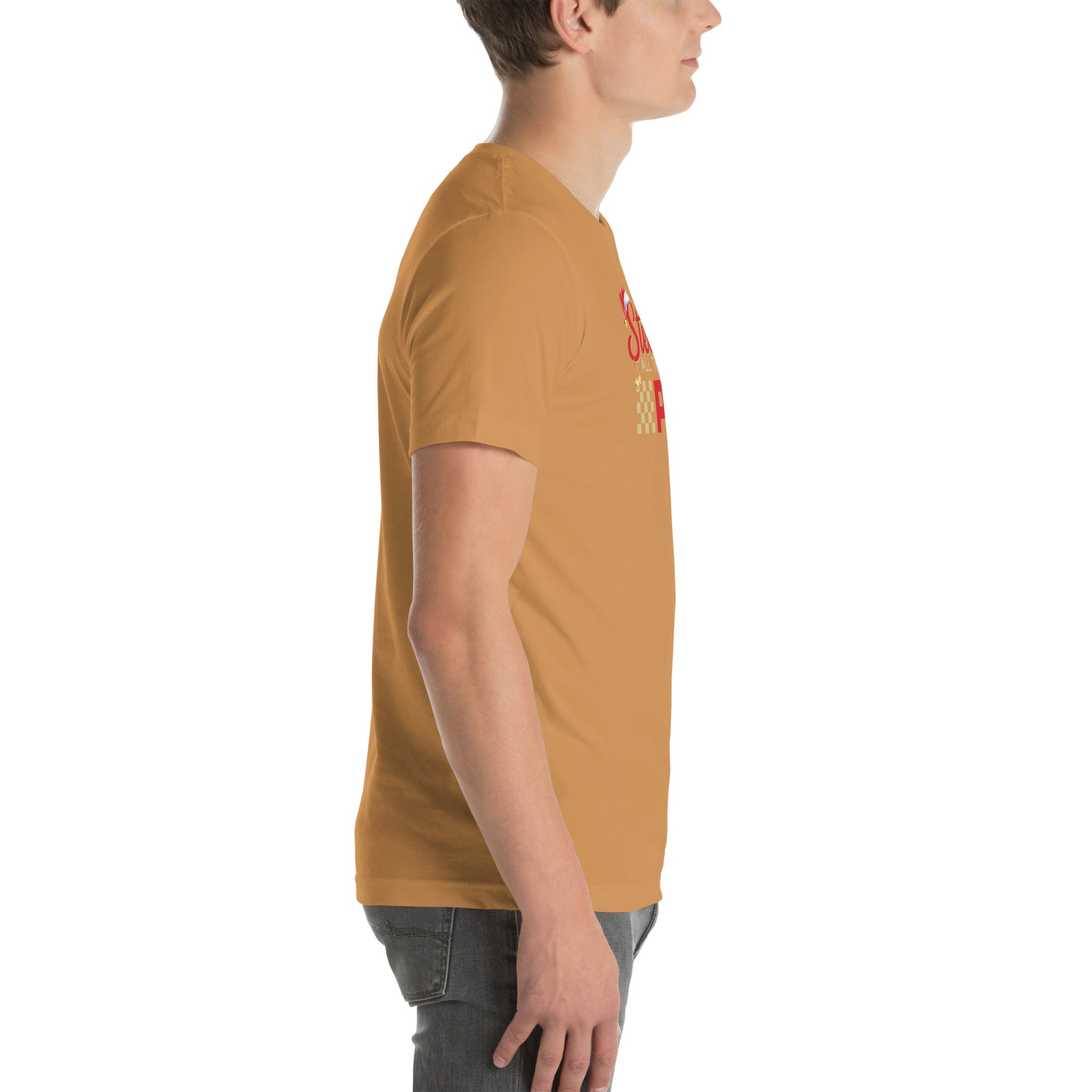 Side view of an adult model facing the right edge of the screen wearing a toast orange-brown short-sleeve T-shirt you can see the edge of a red and gold design on the front of the shirt. The background is white. 
