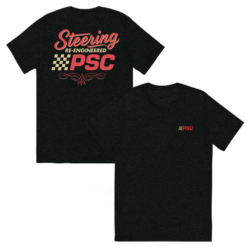 Mock up of the front and back view of a solid black colored short-sleeve T-shirt. The front features a small PSC logo on the left chest with a red ‘PSC’ wordmark and a gold checkered block graphic. The back design shows large red script reading ‘Steering Re-Engineered,’ a gold checkered pattern beneath it, a bold red PSC wordmark, and a decorative red flourish at the bottom.